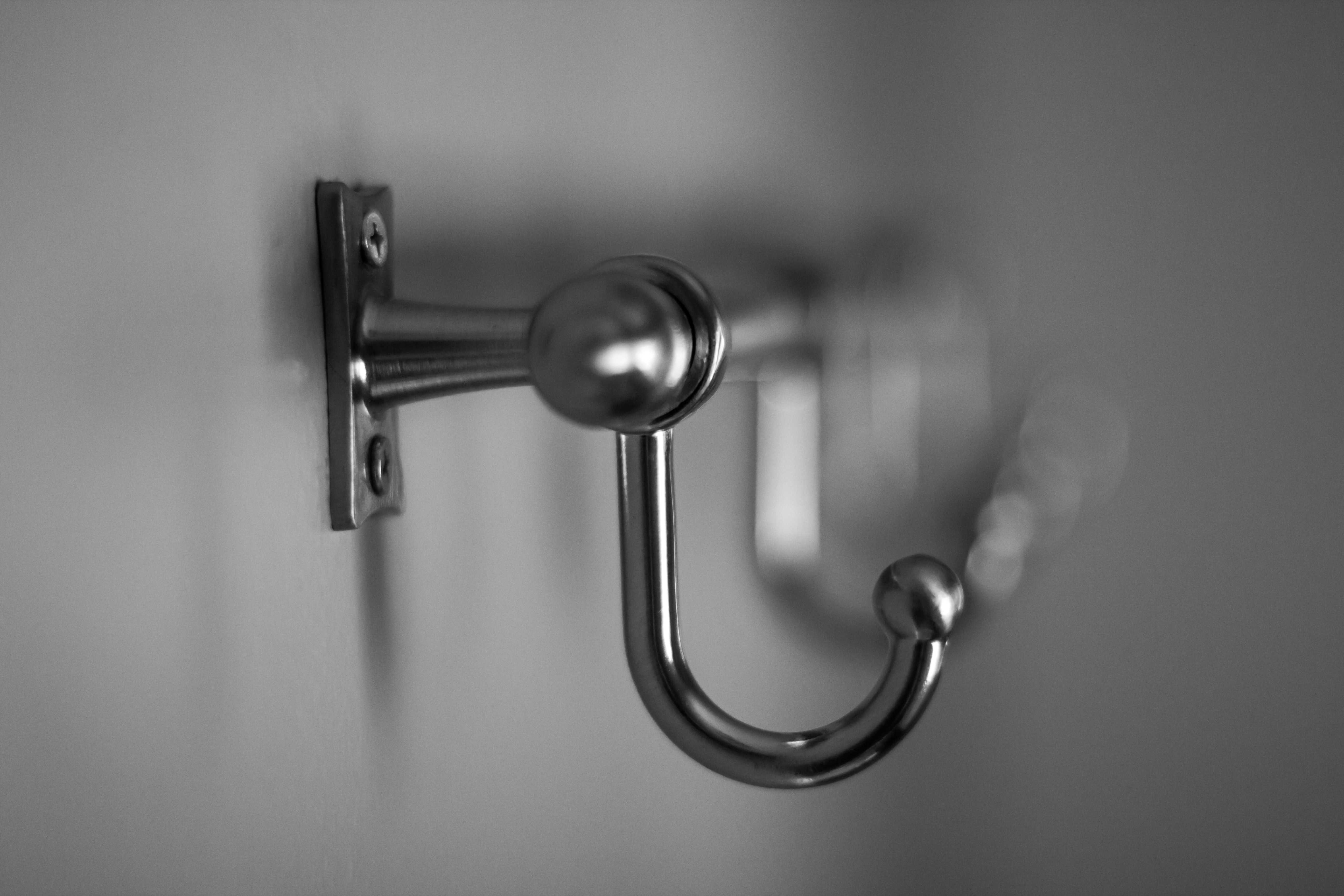 Close-up of a series of metal hooks on a wall