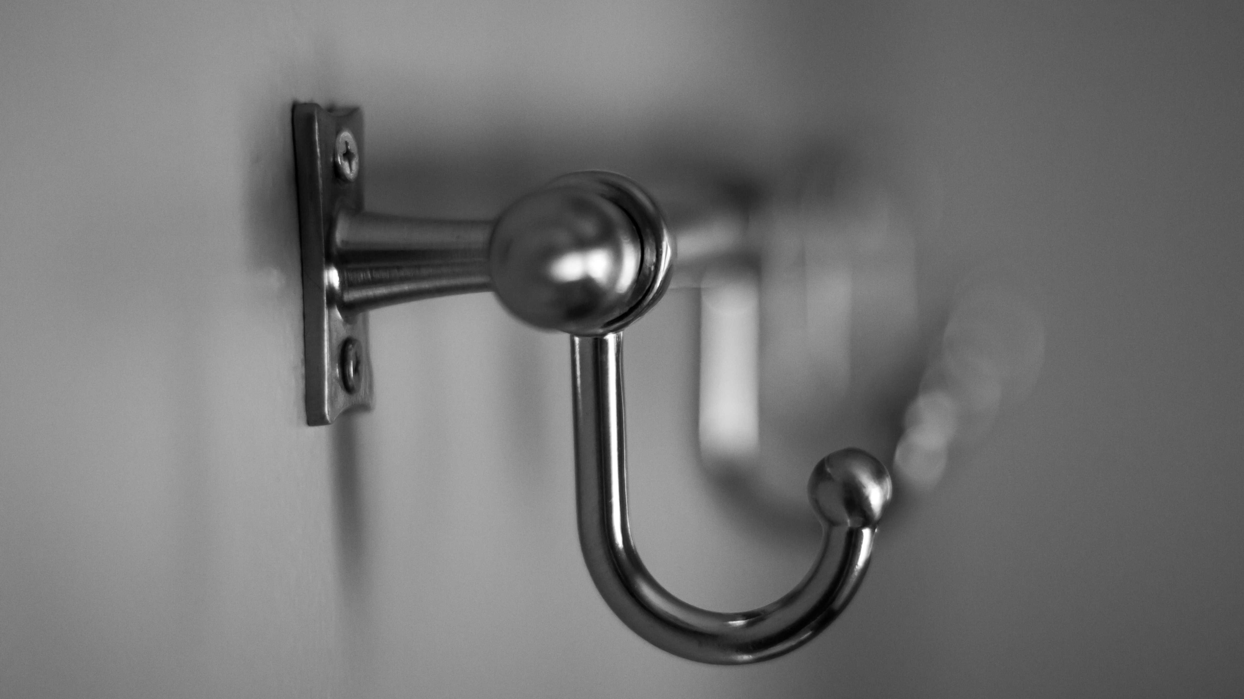 Close-up of a series of metal hooks on a wall
